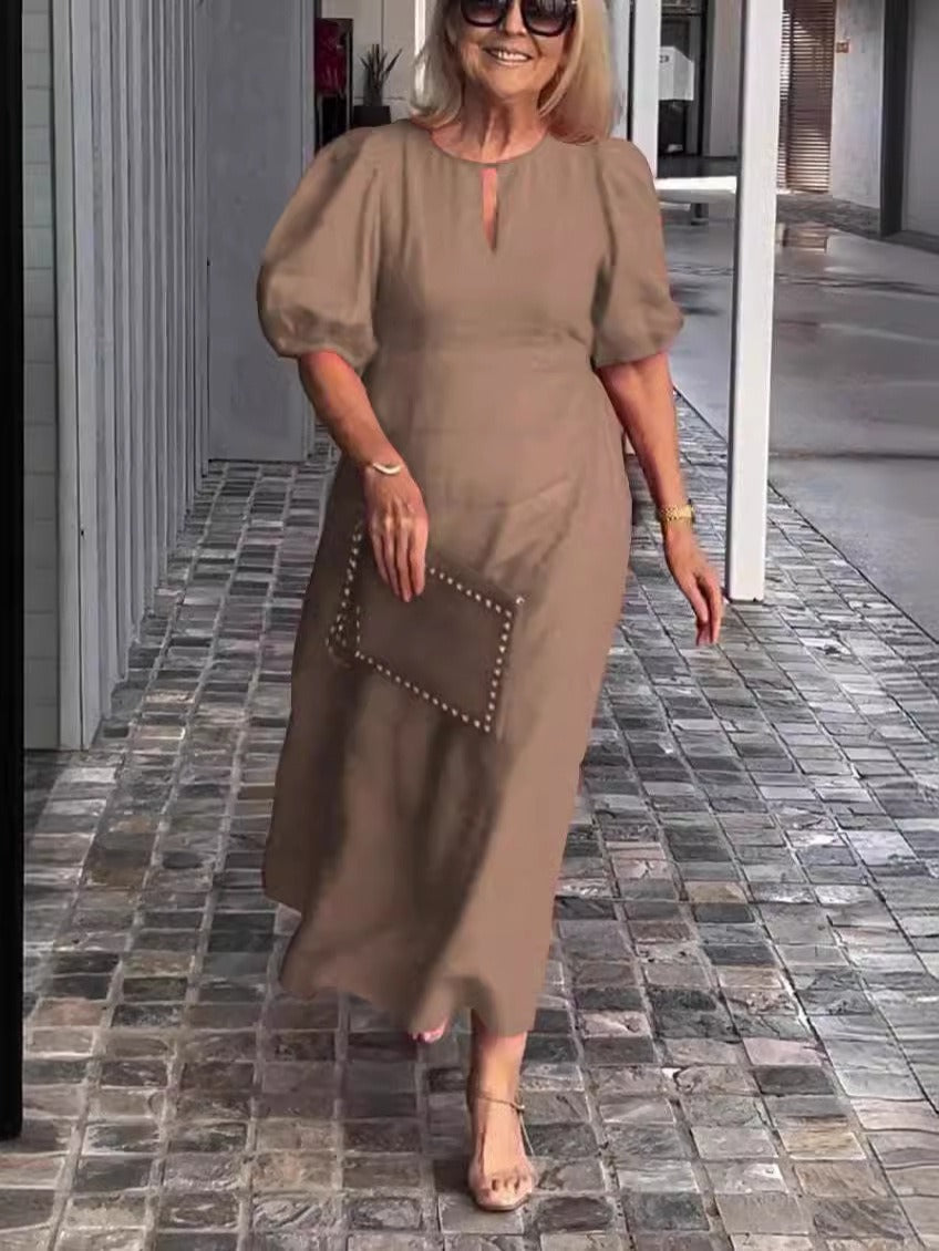 Women's sage green cotton midi dress loose fit silhouette with statement puff sleeves and round neckline