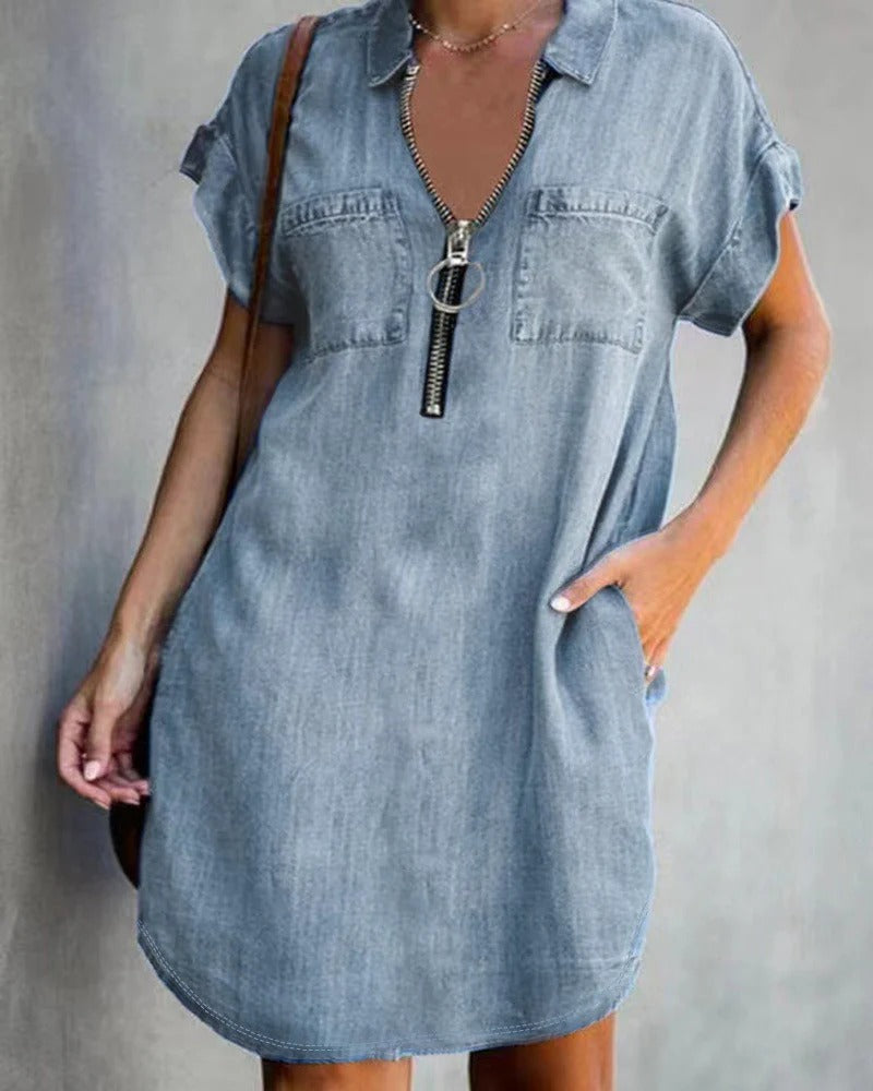 Women's relaxed-fit denim dress with short sleeves, front zipper closure, and utility pockets