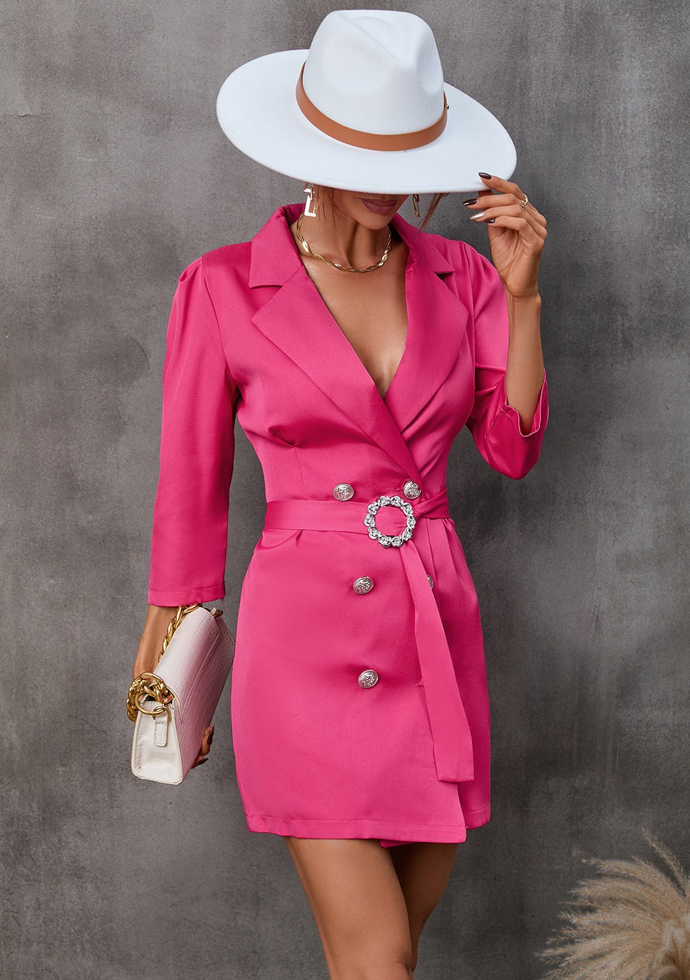 Women's black blazer dress with belted waist, notched lapel, and tailored wrap mini silhouette