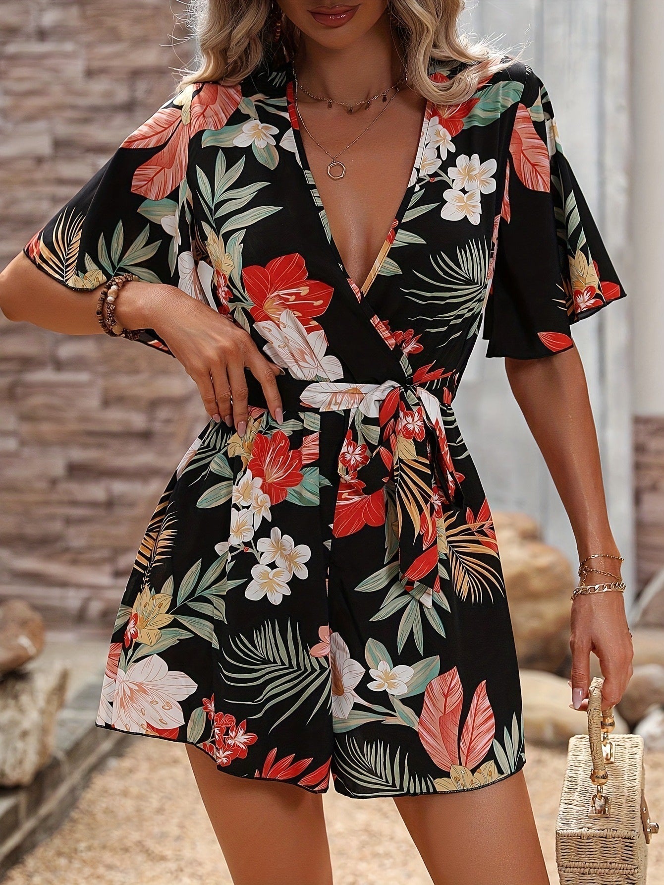 Women's floral print wrap V-neck cotton romper with ruffled sleeves and belted waist