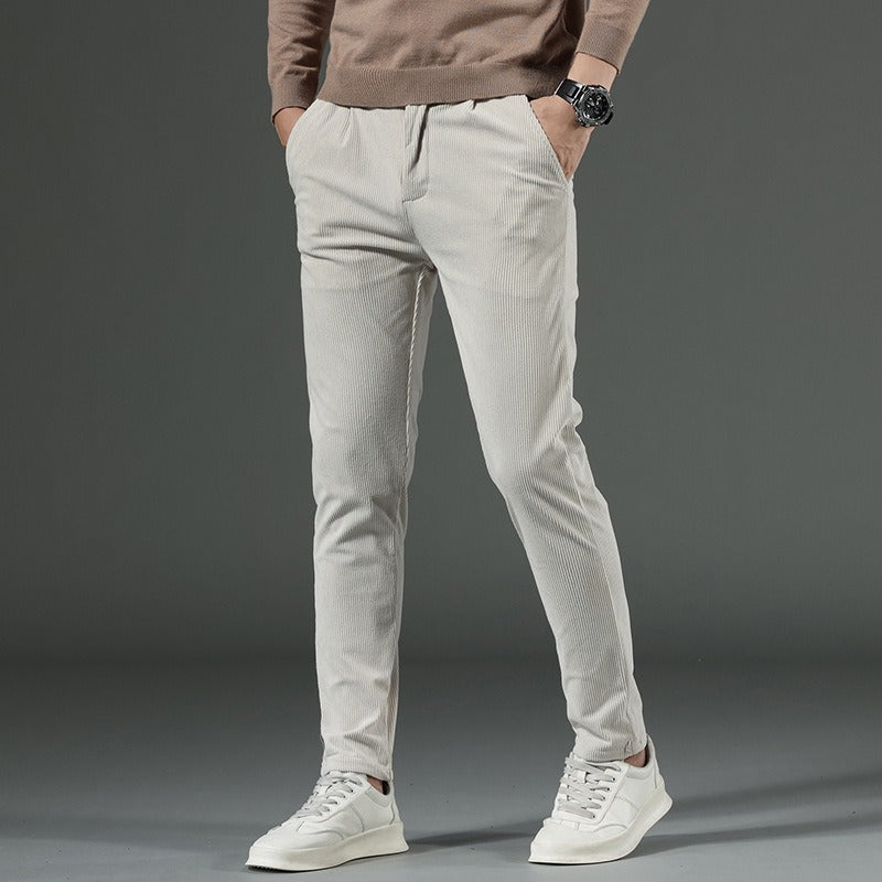 Black slim straight-leg corduroy pants for men with flat front design and full length silhouette