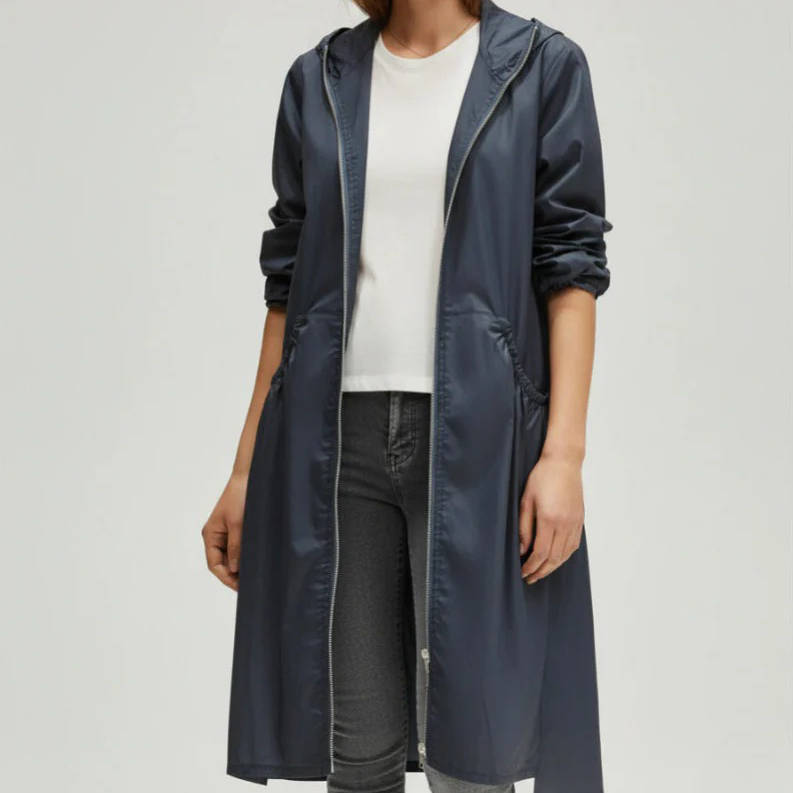 Women's waterproof long jacket mid-knee silhouette sealed seams rain snow all-weather commuter coat