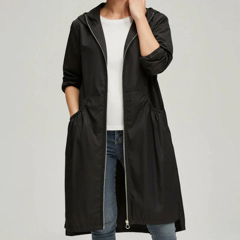 Women's waterproof long jacket mid-knee silhouette sealed seams rain snow all-weather commuter coat
