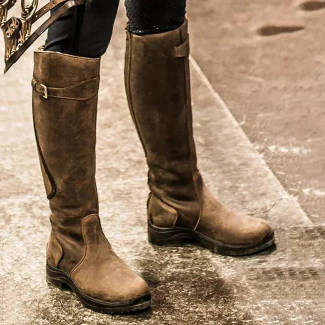 Women's brown genuine leather equestrian riding boots with side zipper closure and waterproof construction