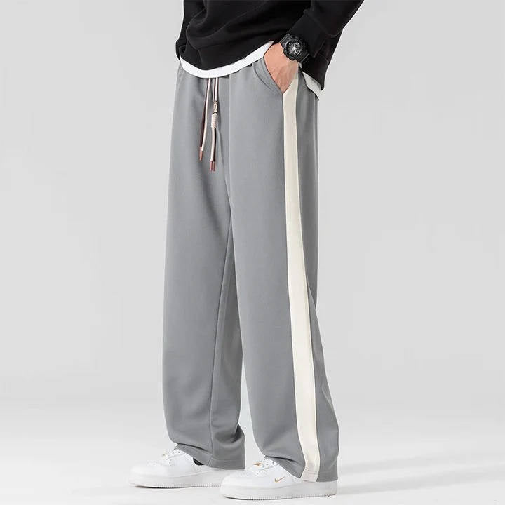 Men's loose fit sweatpants in grey with side stripe detail and adjustable drawstring waist