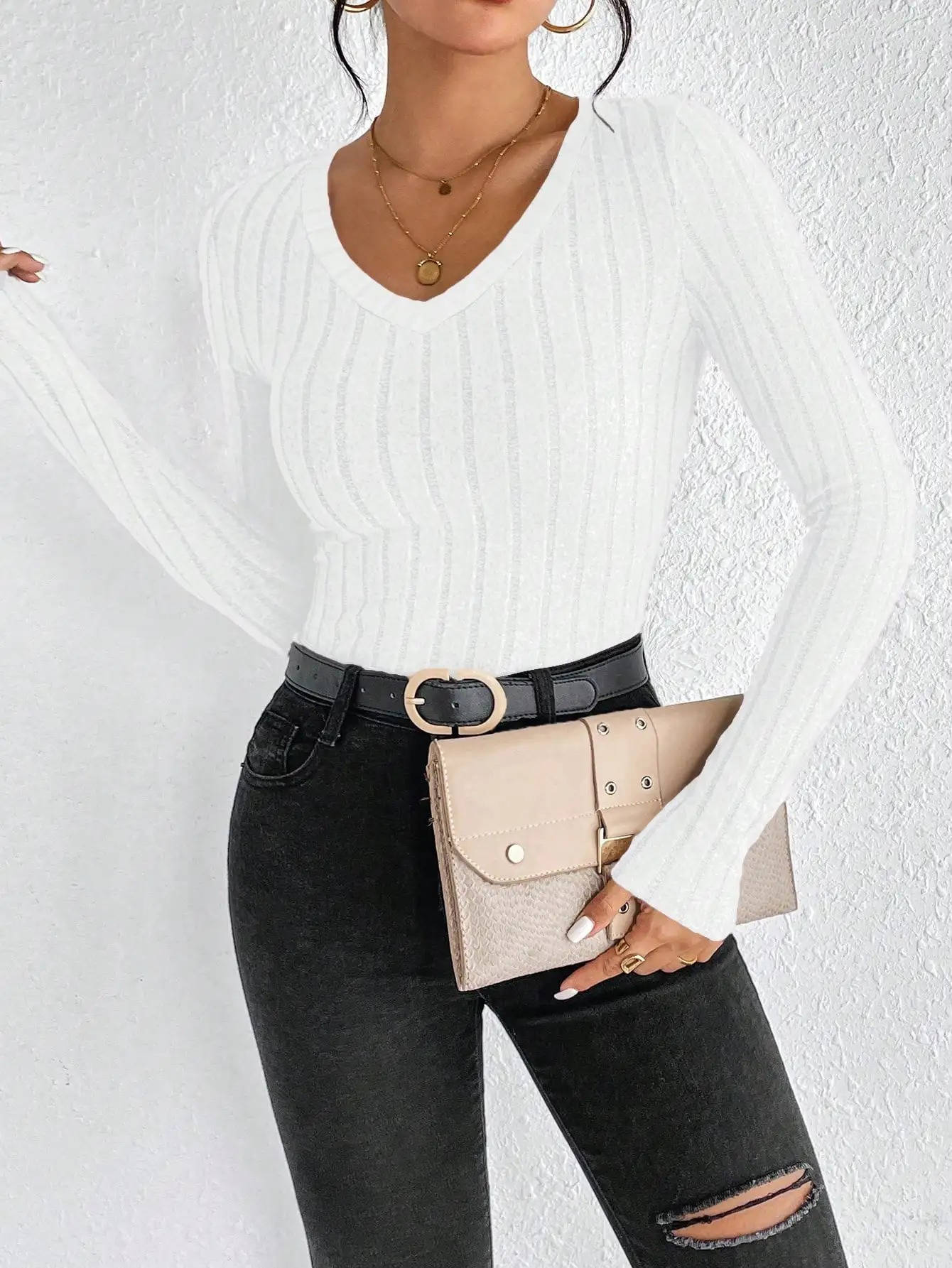 Women's cozy V-neck knit sweater in versatile solid color, flattering silhouette, wrinkle-resistant everyday staple