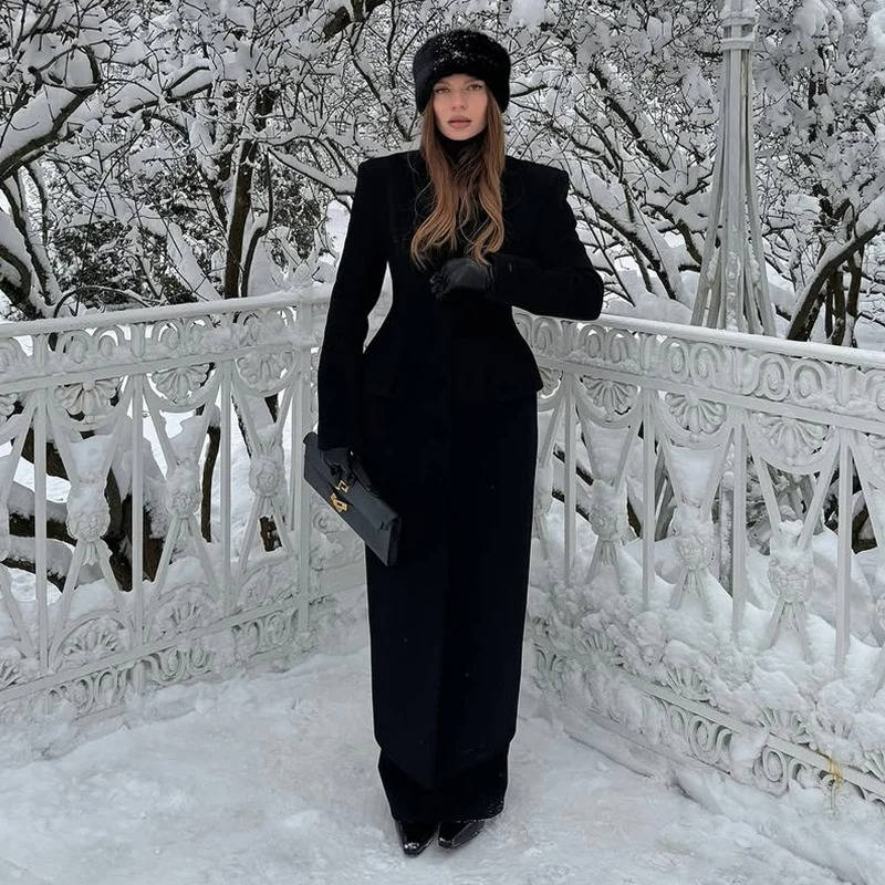 Women's long single-breasted wool overcoat in classic neutral tone, polished wrinkle-resistant winter style
