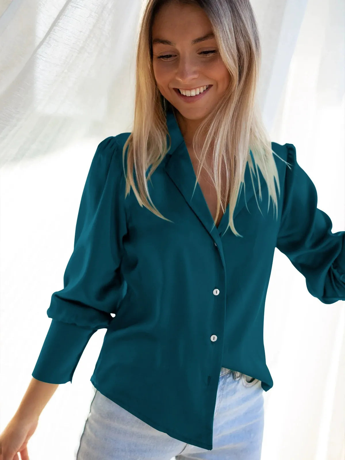 Women's relaxed fit long sleeve blouse with elegant draping and classic button closure