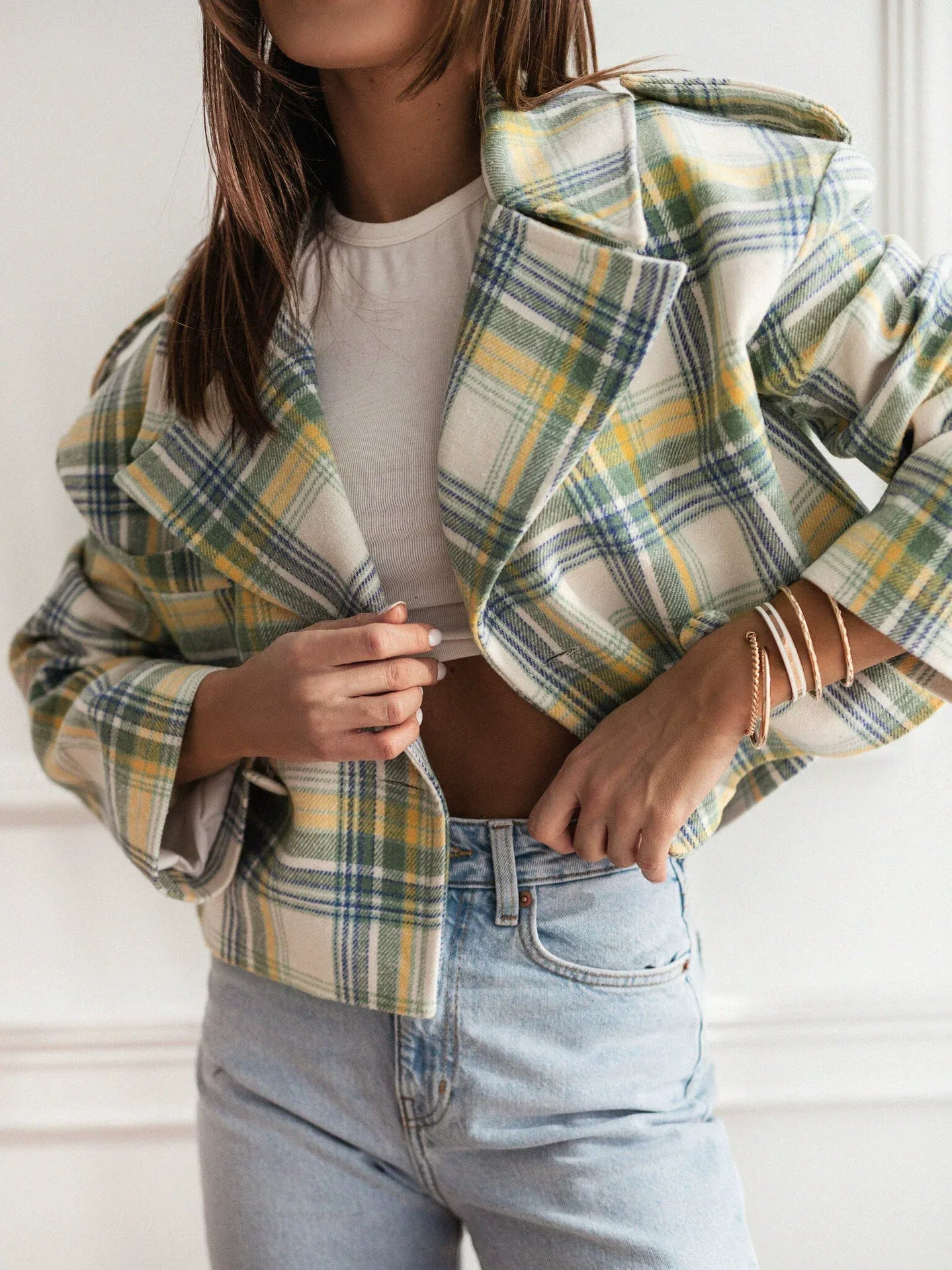 Women's cropped tailored wool checkered blazer with classic lapel for a polished professional look