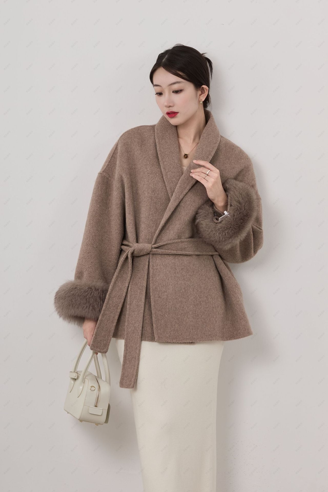 Women's wool blend short wrap coat with belted waist, shawl collar, and removable cuffs for work to evening