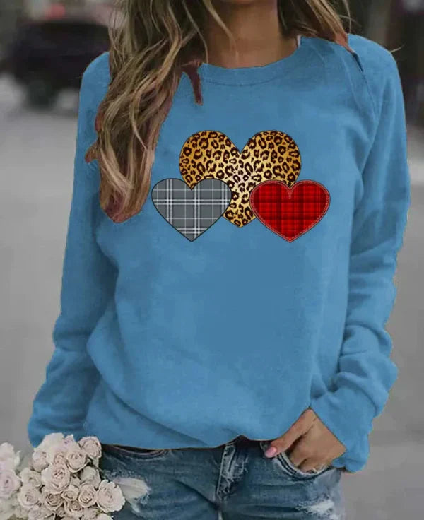 Women's loose fit long sleeve sweatshirt soft cozy fabric with charming heart print for everyday comfort
