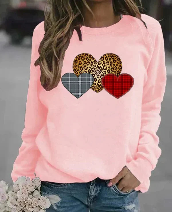 Women's loose fit long sleeve sweatshirt soft cozy fabric with charming heart print for everyday comfort