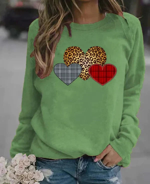 Women's loose fit long sleeve sweatshirt soft cozy fabric with charming heart print for everyday comfort