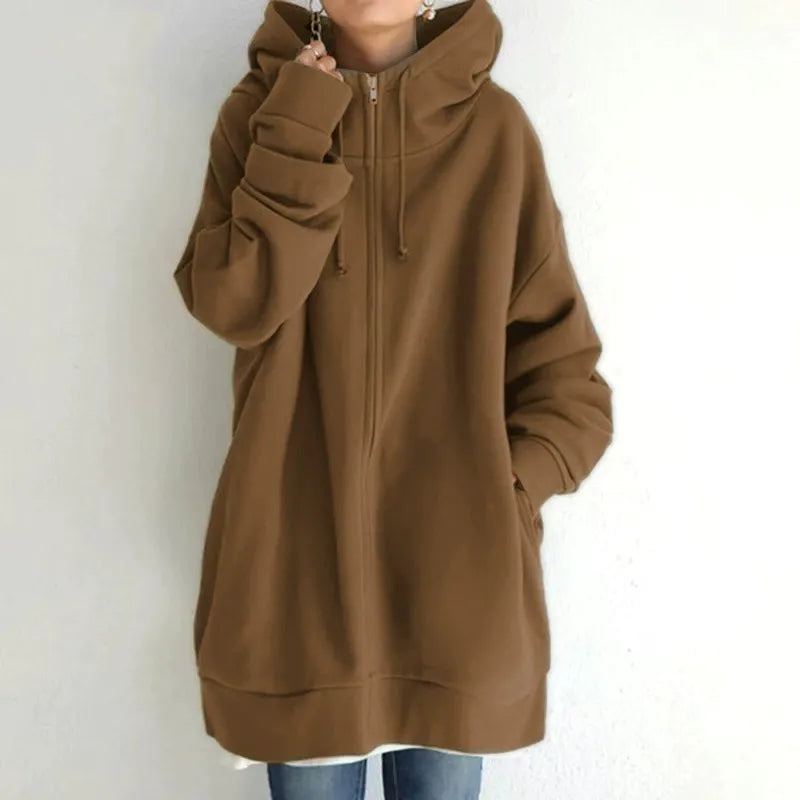 Women's oversized fleece-lined zip-up hoodie in urban streetwear style with cozy warm fit