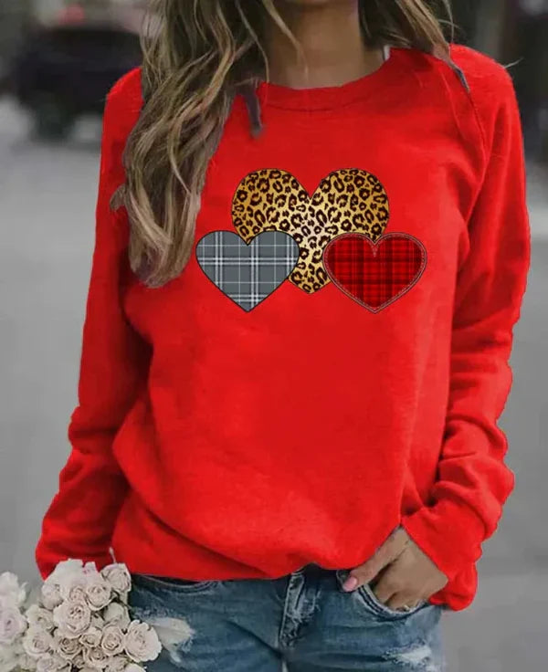 Women's loose fit long sleeve sweatshirt soft cozy fabric with charming heart print for everyday comfort