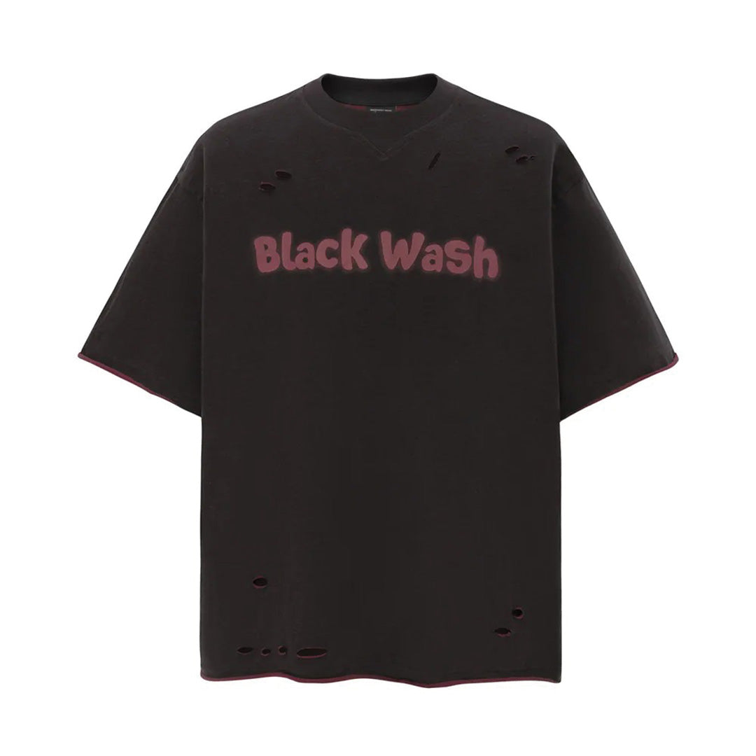 Black distressed relaxed fit graphic tee with spray paint chest print and raw edge streetwear detailing