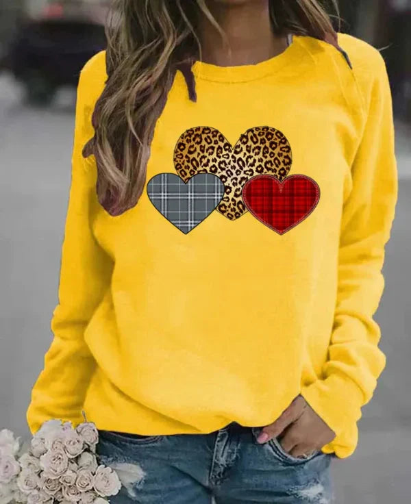 Women's loose fit long sleeve sweatshirt soft cozy fabric with charming heart print for everyday comfort