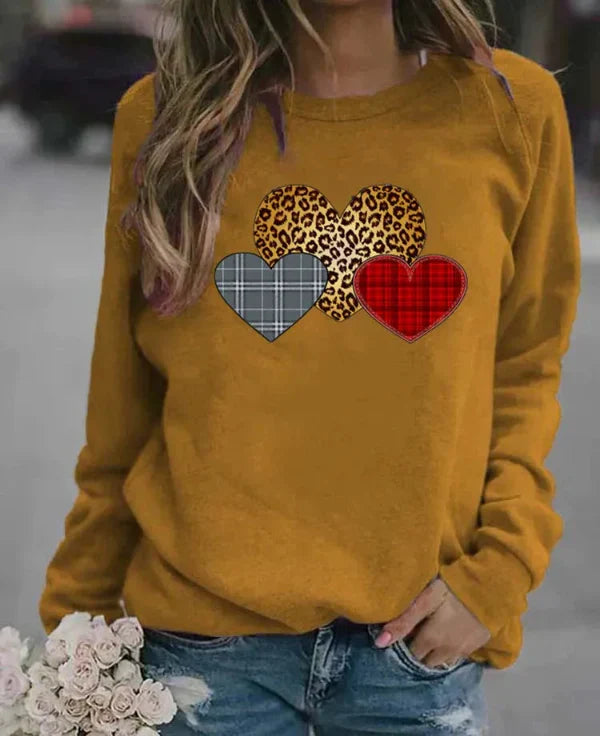 Women's loose fit long sleeve sweatshirt soft cozy fabric with charming heart print for everyday comfort