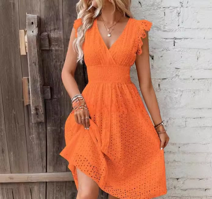 White women's A-line wrap dress with eyelet embroidery and ruffled sleeves, breathable brunch style