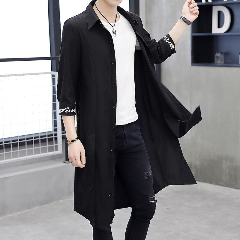 Men's oversized beige cotton-blend trench coat with relaxed silhouette and long sleeves for casual style