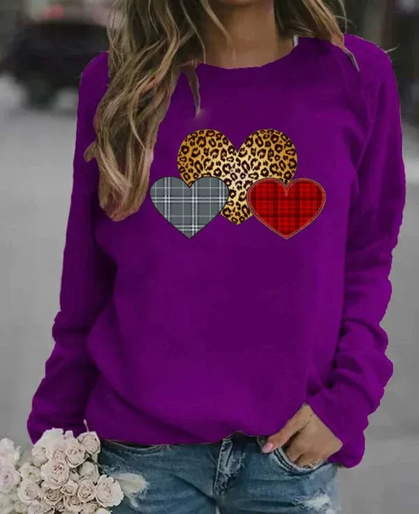 Women's loose fit long sleeve sweatshirt soft cozy fabric with charming heart print for everyday comfort