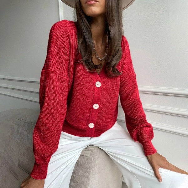 Women's relaxed fit rib knit cardigan with V-neck, button closure, and rolled sleeves for versatile layering