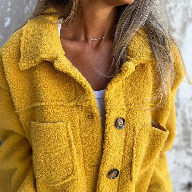 Women's relaxed fit wool-blend coat with wide lapel, oversized buttons, and patch pockets
