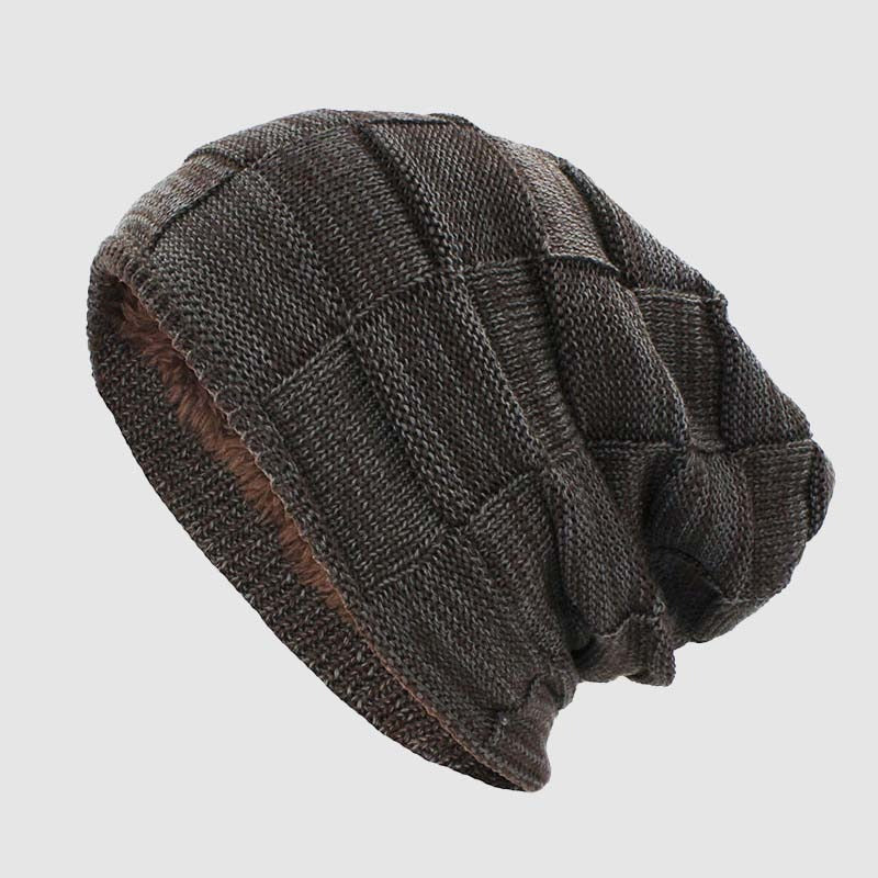 Dark ribbed knit urban beanie with plush fleece interior, minimalist style for cold weather commuters