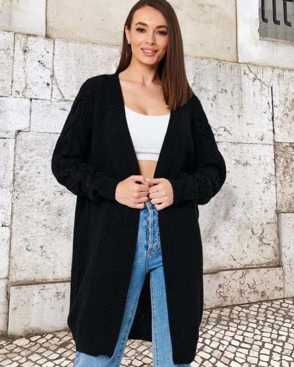 Women's oversized long open-front knit coat with cable knit sleeves, cozy layering essential