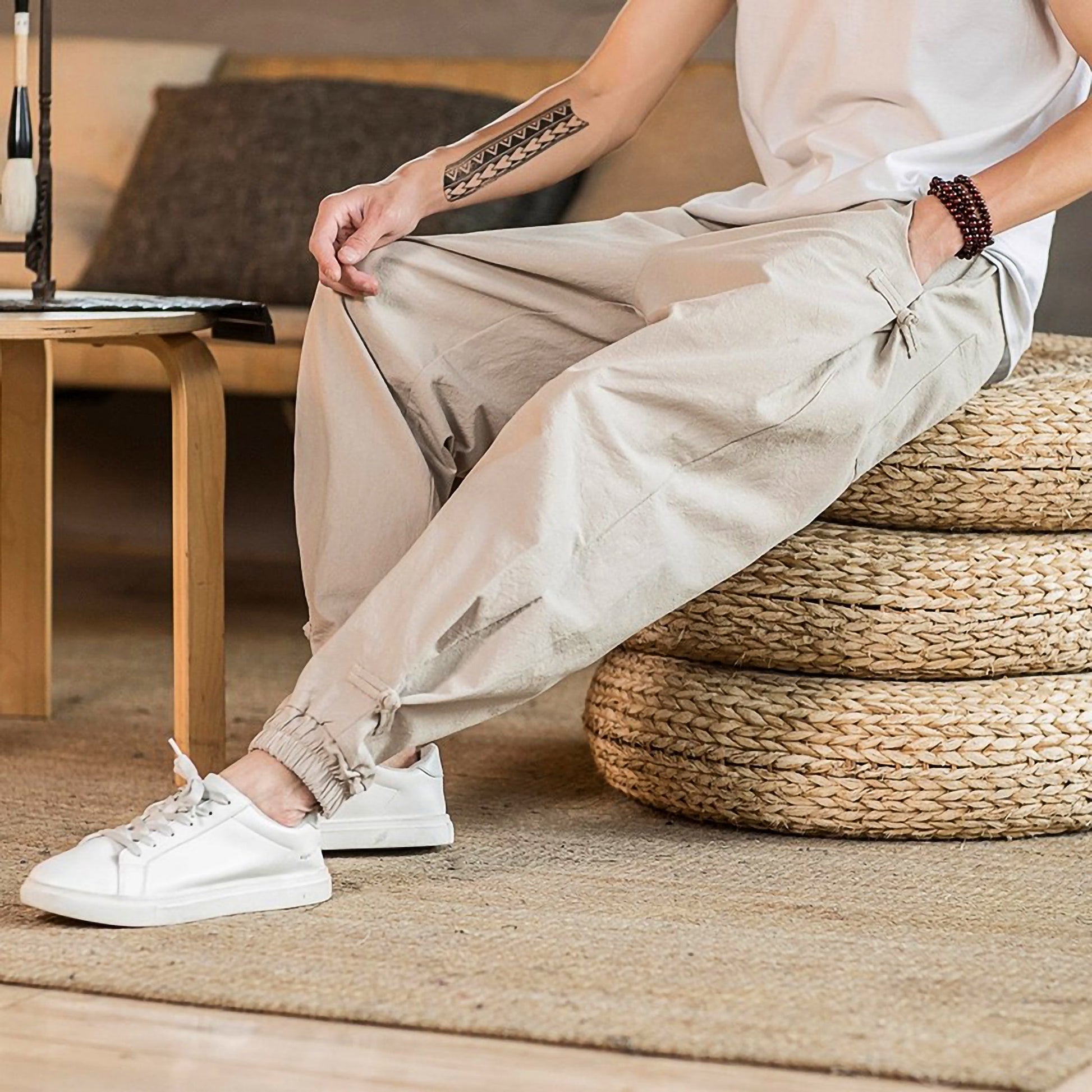 Toka relaxed tapered cotton-blend pants in neutral tone with adjustable drawstring waist