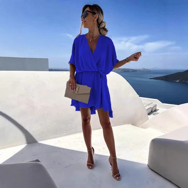 Women's wrap dress deep V-neck cinched waist flutter hem summer style versatile chic silhouette