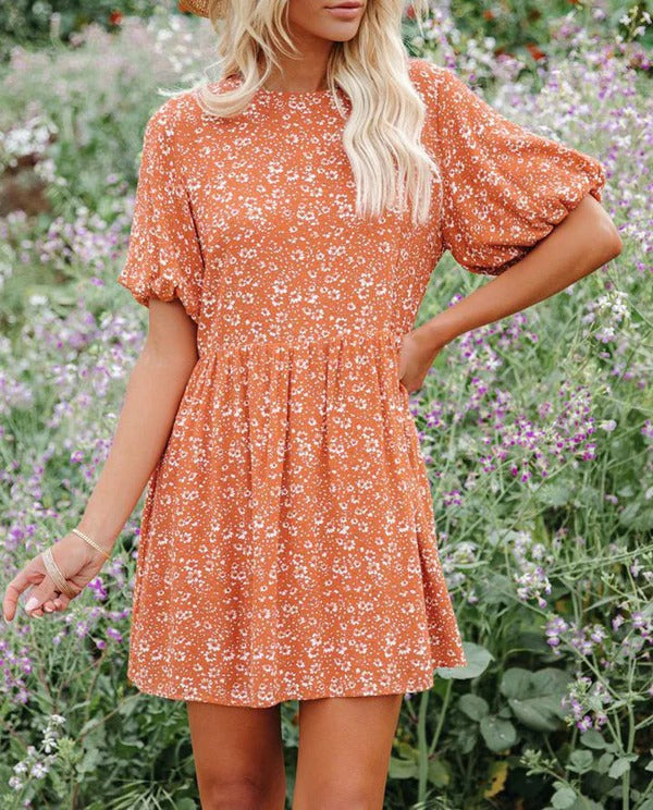 Women's floral A-line mini dress with romantic puff sleeves, breezy casual vacation style