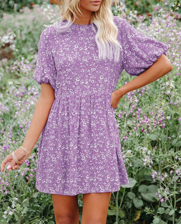 Women's floral A-line mini dress with romantic puff sleeves, breezy casual vacation style