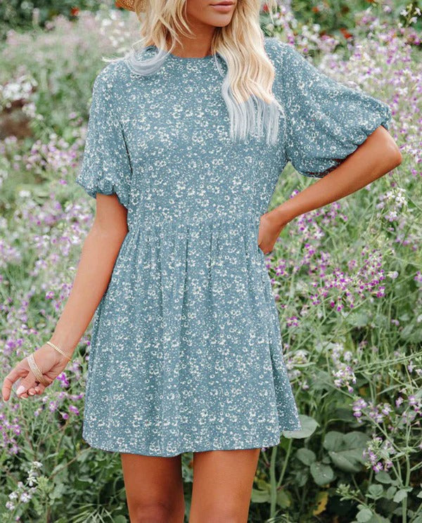 Women's floral A-line mini dress with romantic puff sleeves, breezy casual vacation style