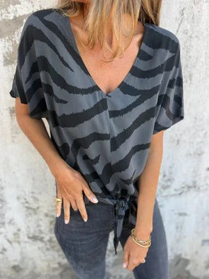 Women's relaxed fit V-neck blouse with tie-front detail and short sleeves for everyday wear