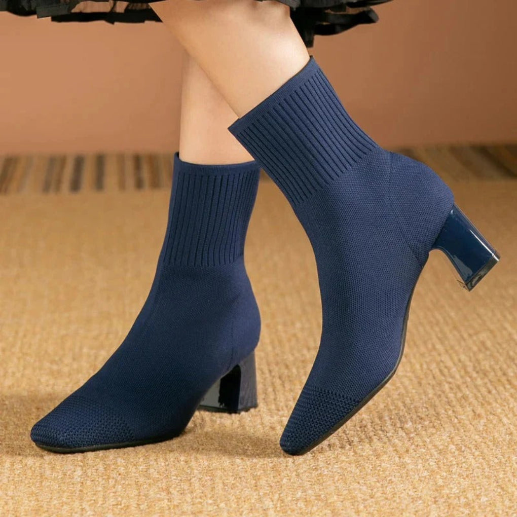 Women's ribbed knit ankle boots in neutral tone, snug fit with textured stretch design for winter warmth