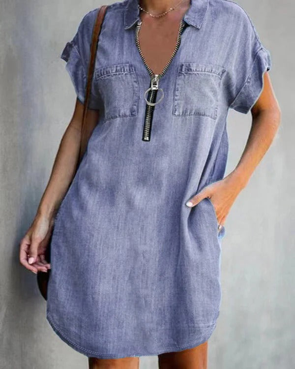 Women's relaxed fit denim dress with short sleeves, front zipper closure, and utility pockets