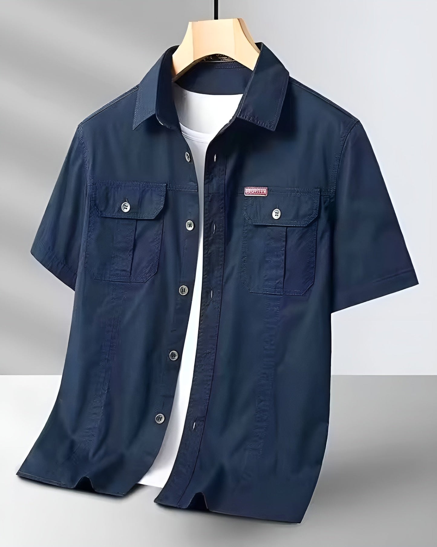 Men's khaki short-sleeve cargo field shirt with dual flap pockets and crisp collar cotton blend
