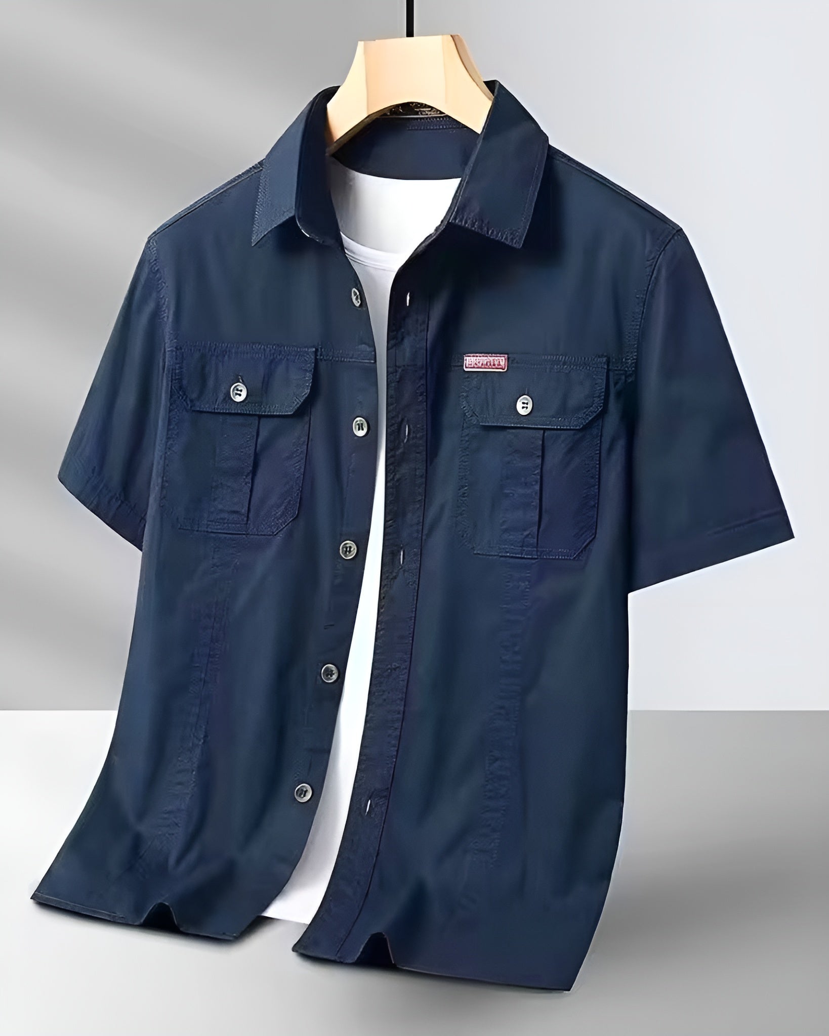 Men's khaki short-sleeve cargo field shirt with dual flap pockets and crisp collar cotton blend