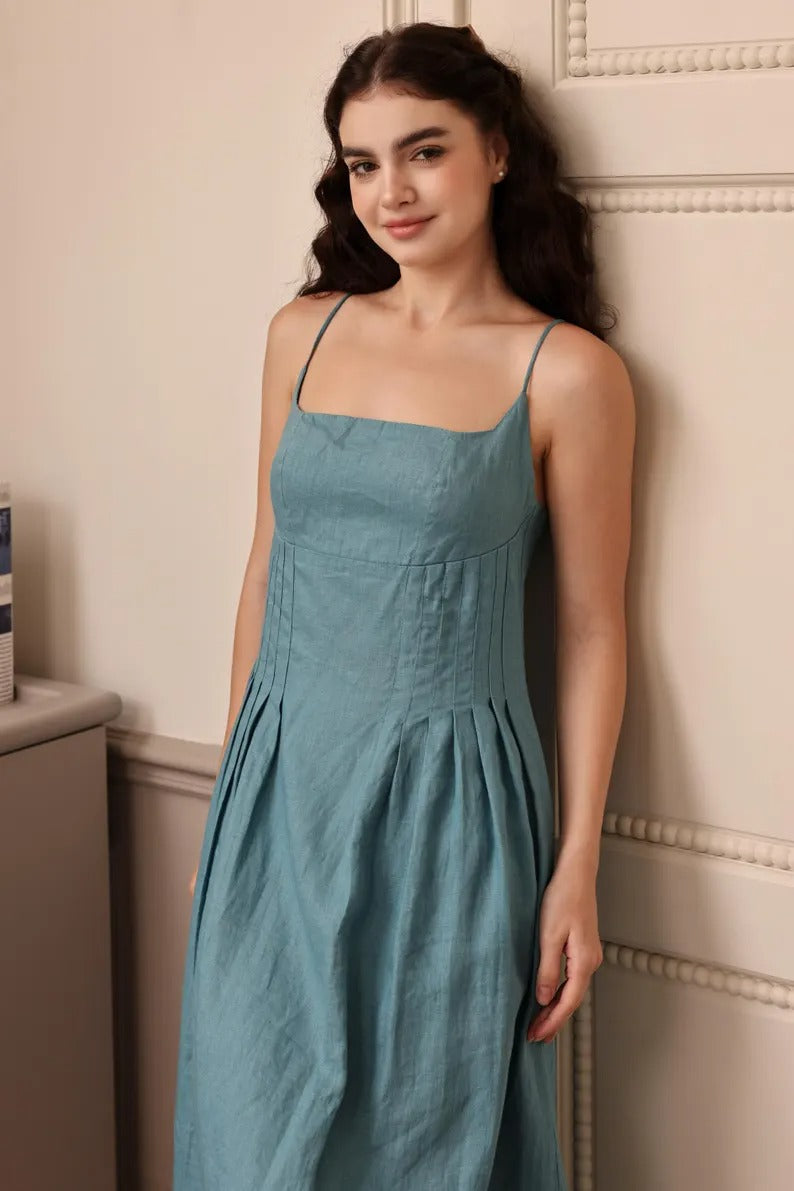Women's white sleeveless linen sun dress with square neckline and minimalist silhouette