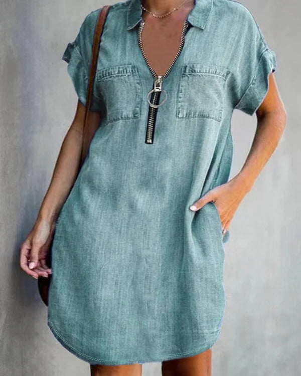 Women's relaxed fit denim dress with short sleeves, front zipper closure, and utility pockets