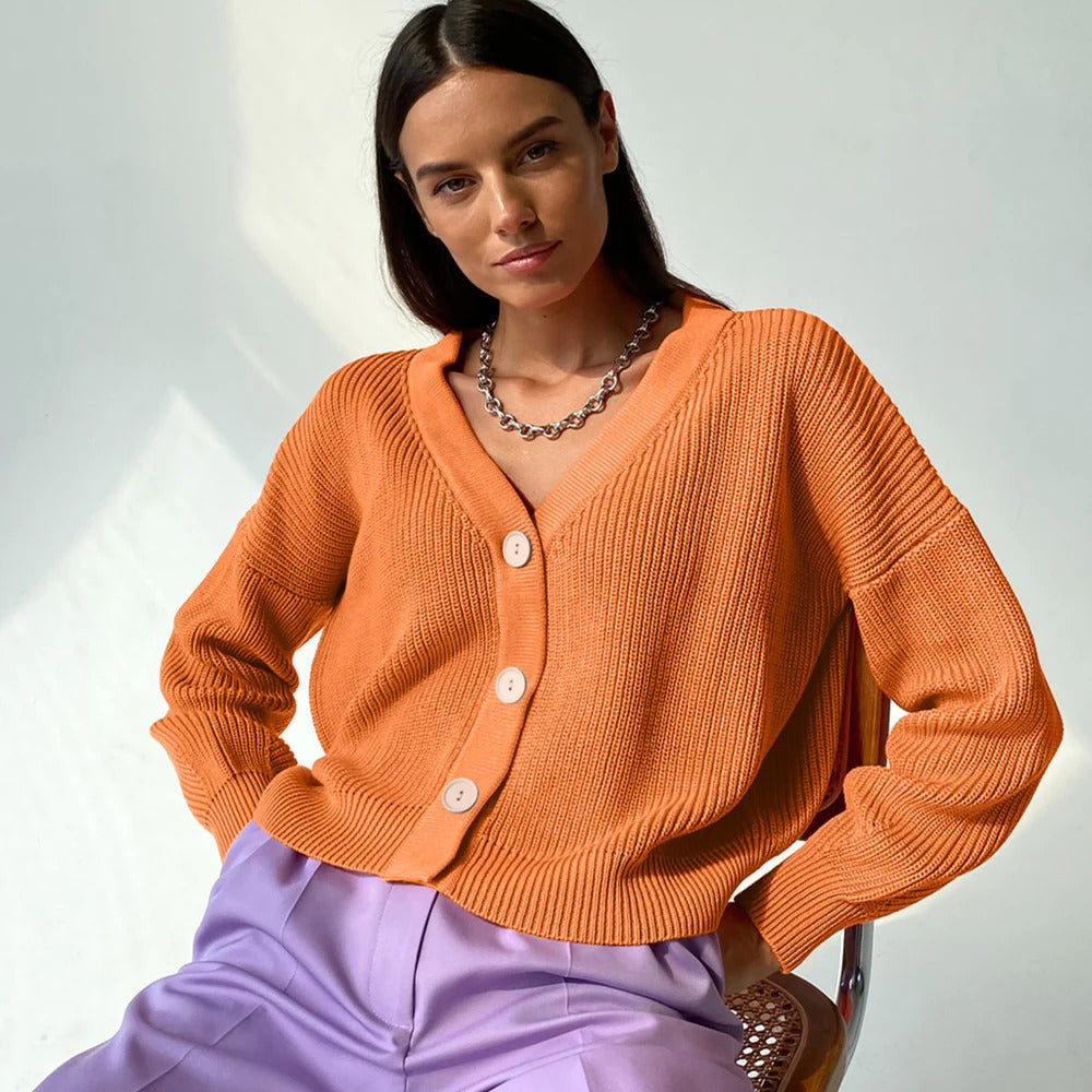 Women's relaxed fit rib knit cardigan with V-neck, button closure, and rolled sleeves for versatile layering