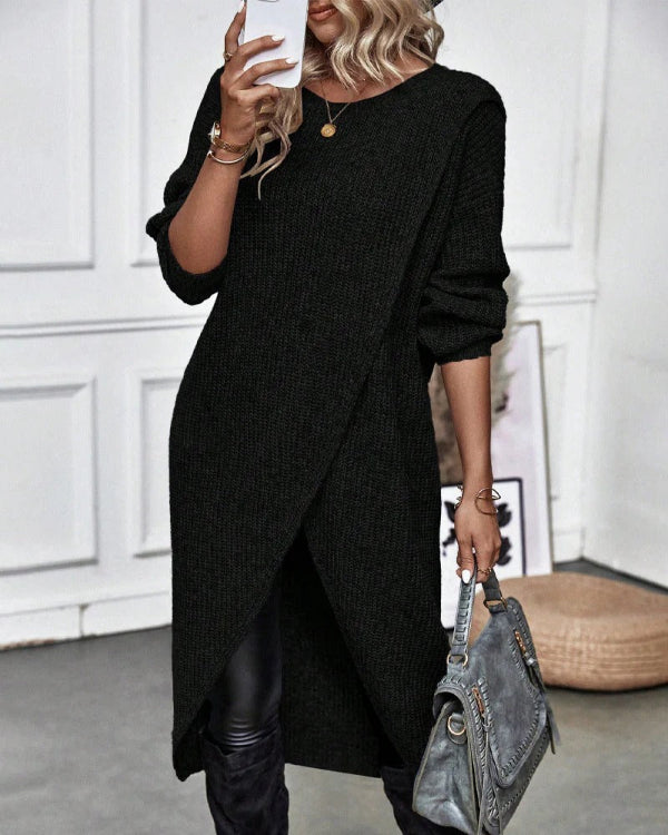 Women's oversized wool knit pullover in neutral tones with asymmetrical wrap drape and ribbed texture