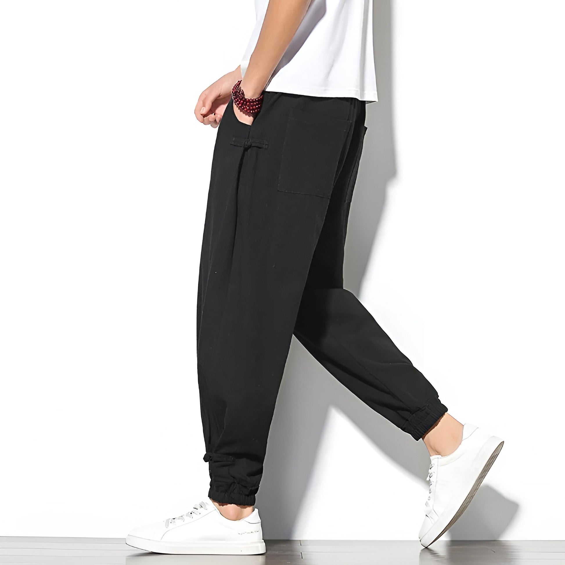 Toka relaxed tapered cotton-blend pants in neutral tone with adjustable drawstring waist