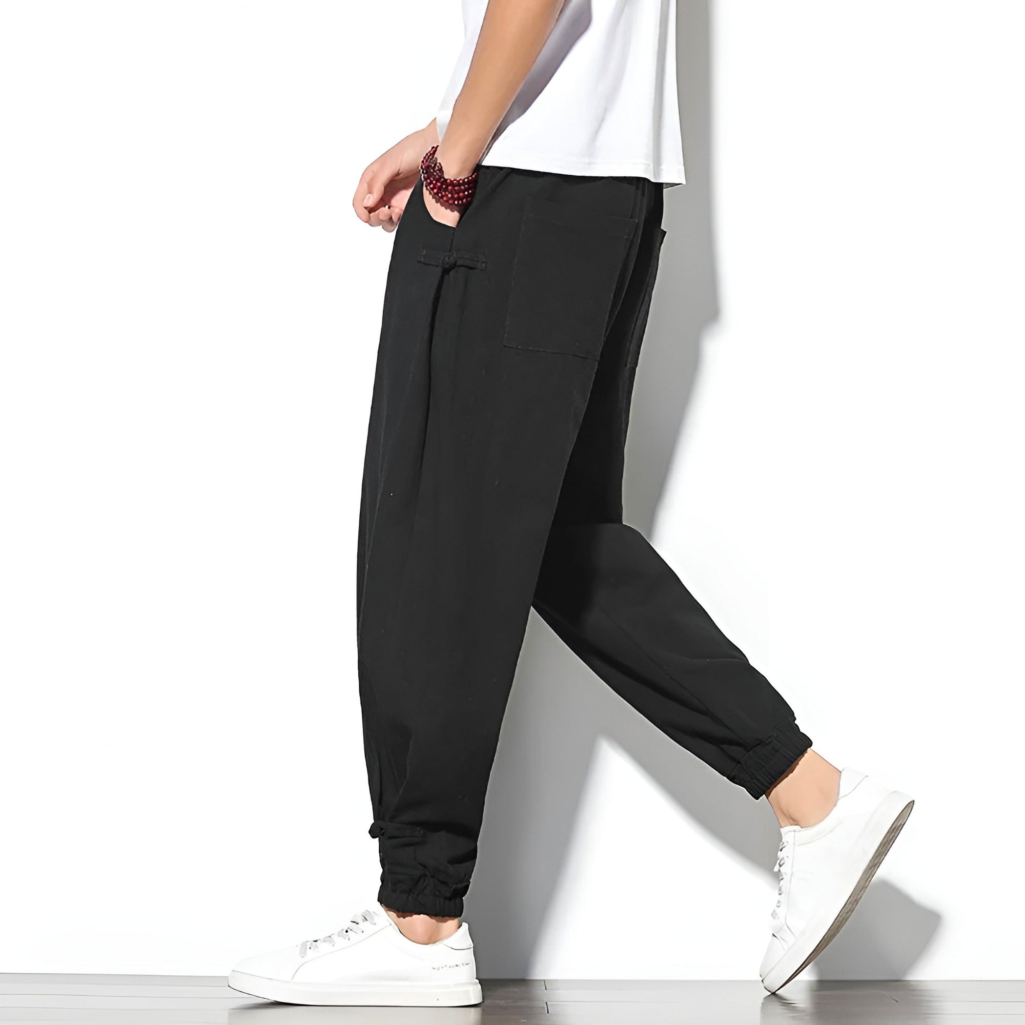 Toka relaxed tapered cotton-blend pants in neutral tone with adjustable drawstring waist