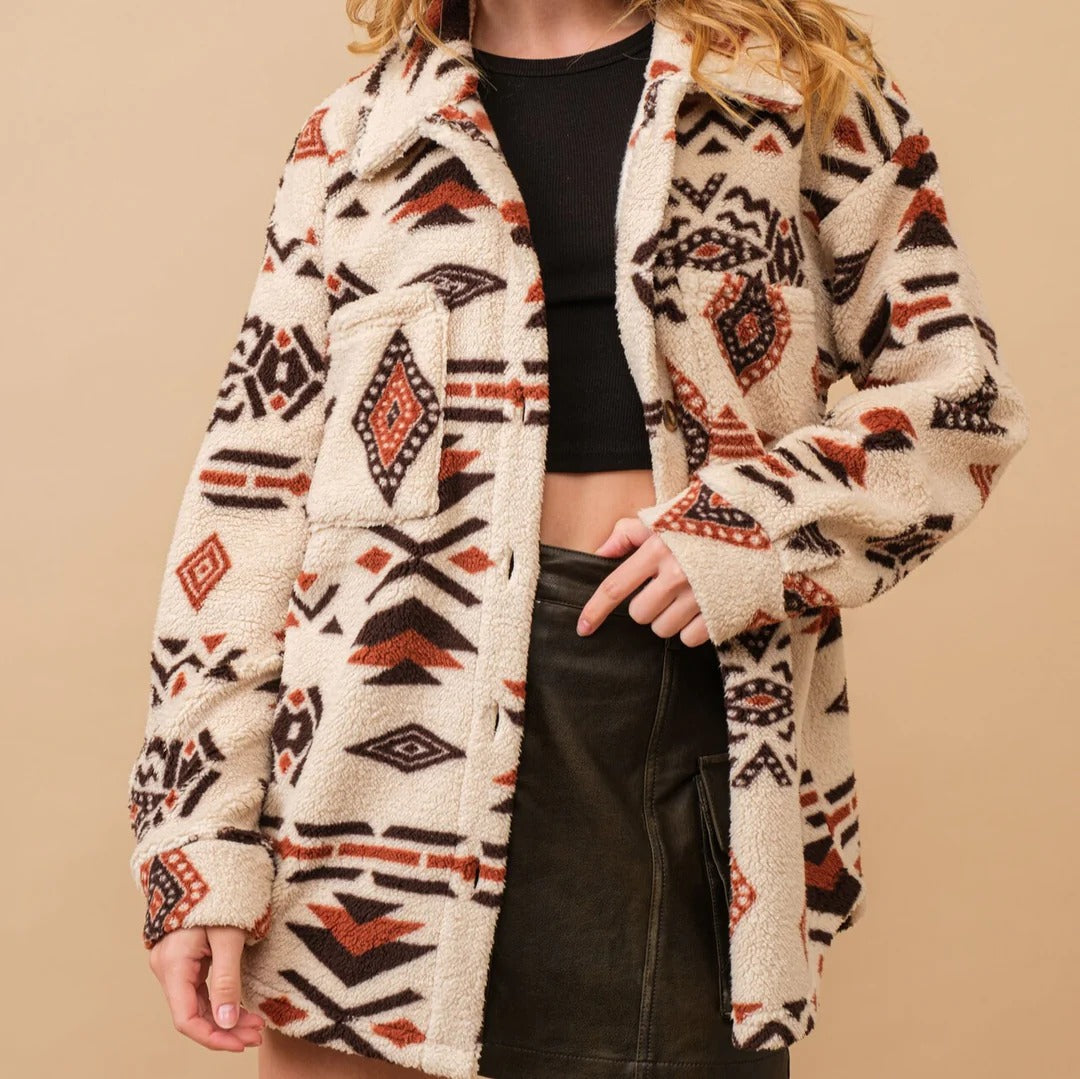 Women's boho western sherpa jacket in desert sunset tones, plush textured cozy outerwear
