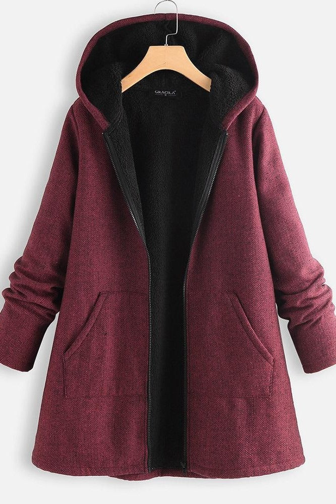 Women's oversized mid-thigh hooded coat plush fleece-lined winter warmth relaxed silhouette