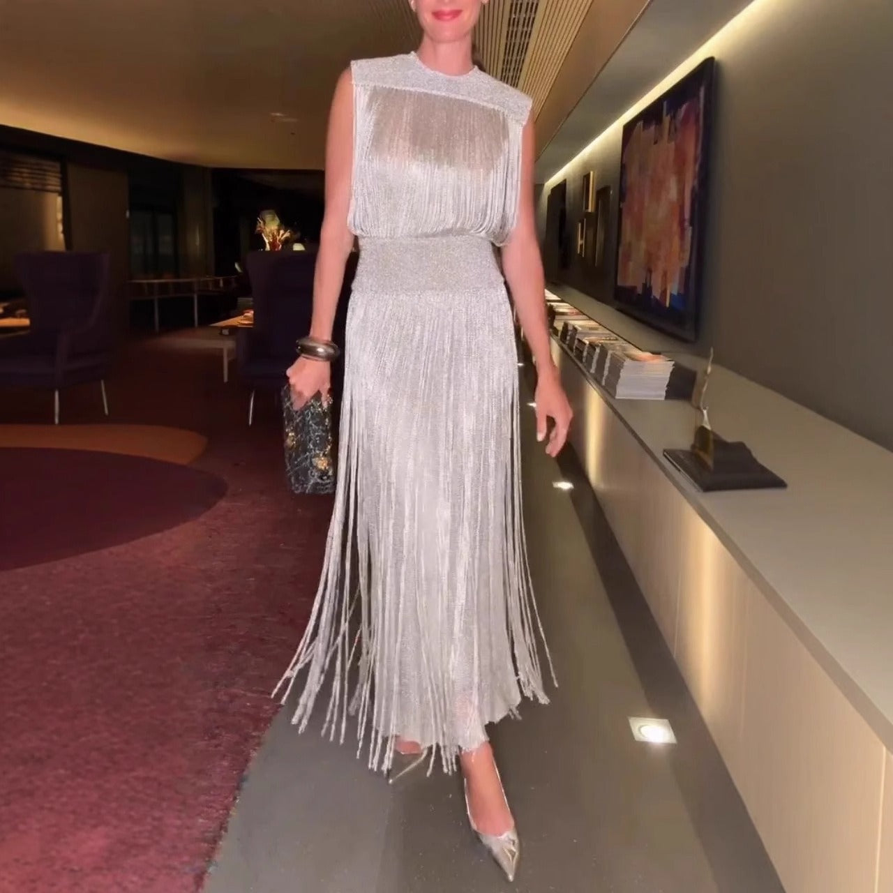 Sleeveless midi dress with fringe hem, silky soft fabric, elegant fit, versatile day-to-night style