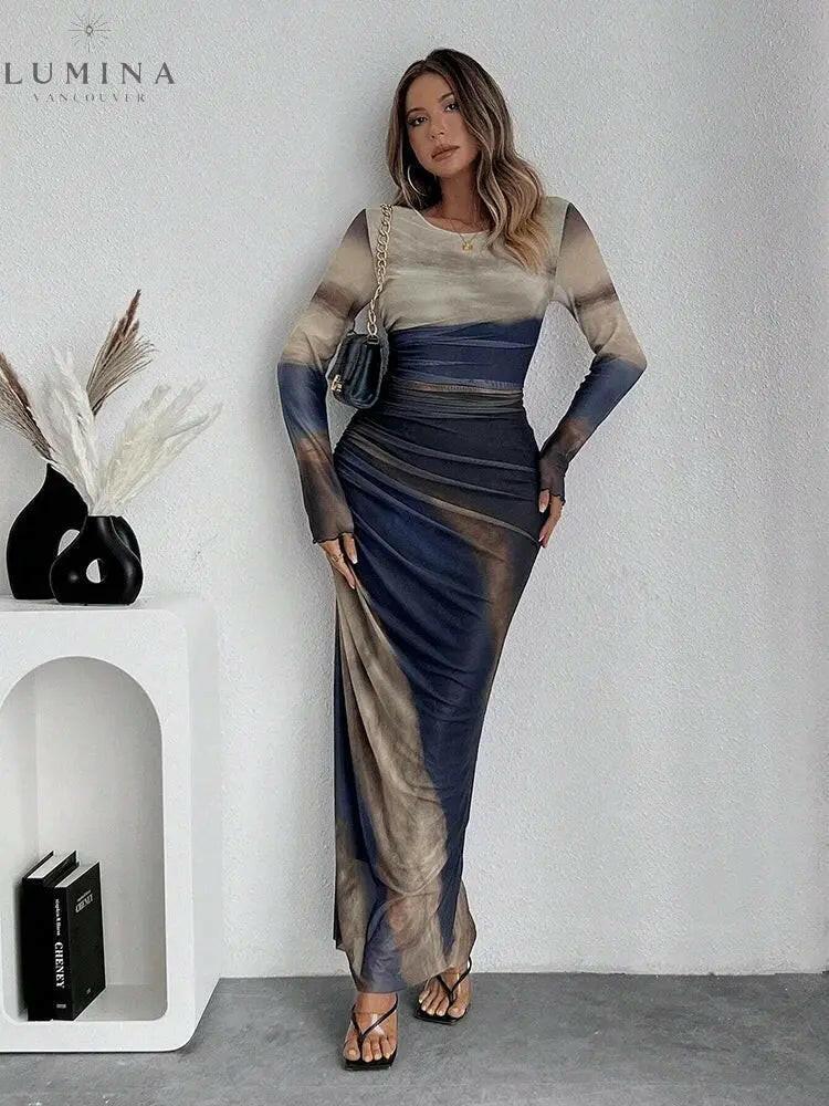 Inara Dream gradient print maxi dress warm fiery hues ruched detailing body-hugging elegant silhouette