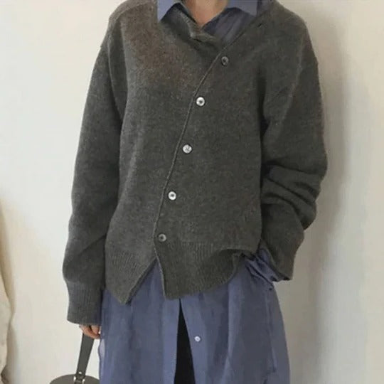 Women's camel cashmere wrap jacket with asymmetrical button closure and relaxed elegant silhouette